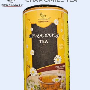 A cup of freshly brewed chamomile tea with dried chamomile flowers from Benchmark Ooty